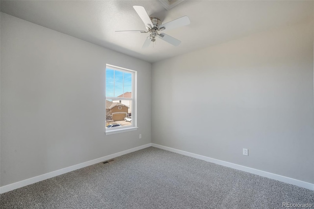 carpeted empty room with ceiling fan