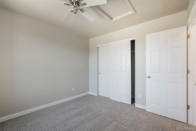 unfurnished bedroom with carpet, ceiling fan, and a closet