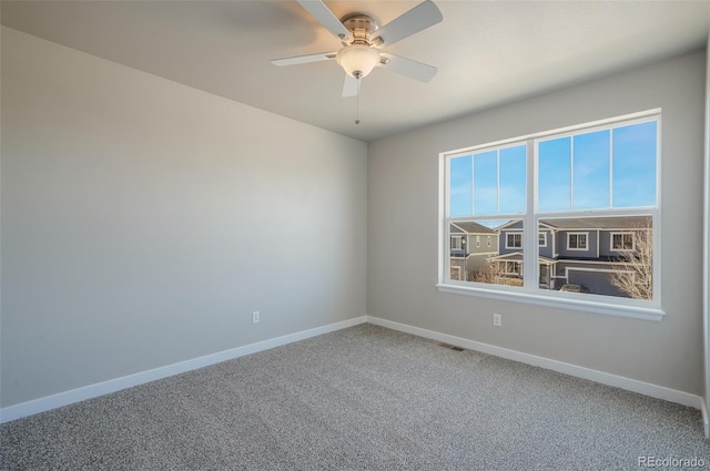 carpeted empty room with ceiling fan