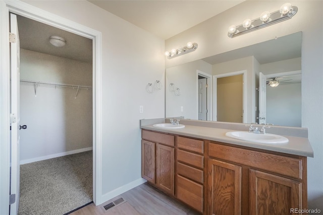 bathroom featuring vanity and ceiling fan