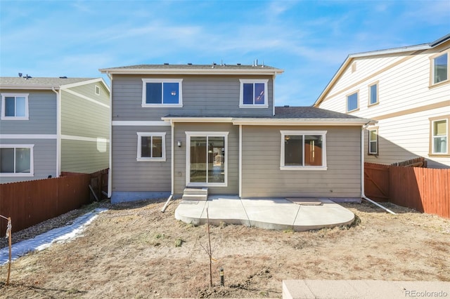 rear view of property featuring a patio area