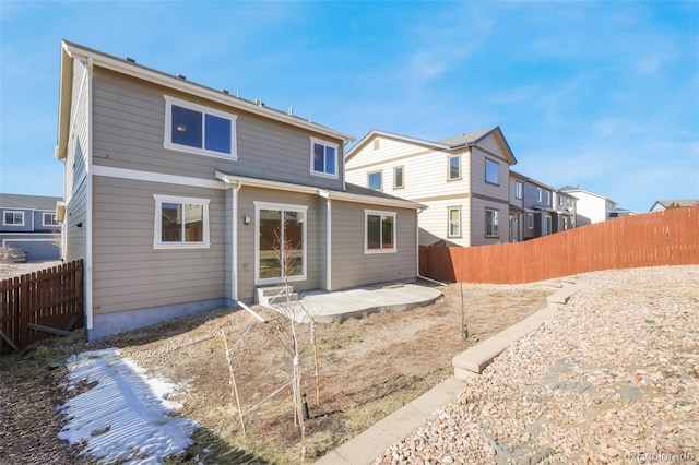 back of property featuring a patio