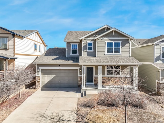 craftsman inspired home with a garage and covered porch