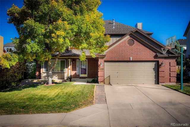 view of front of property with a front yard, an attached garage, a chimney, concrete driveway, and brick siding