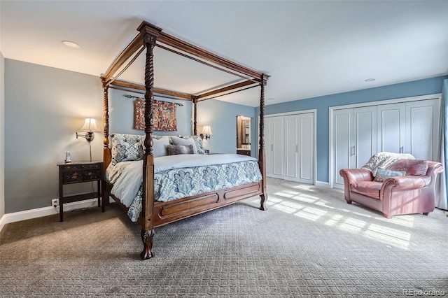 carpeted bedroom featuring two closets