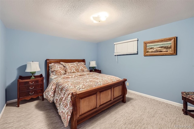 carpeted bedroom featuring a textured ceiling