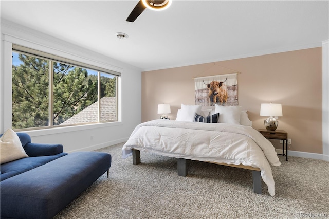 bedroom featuring visible vents, baseboards, carpet, ornamental molding, and a ceiling fan