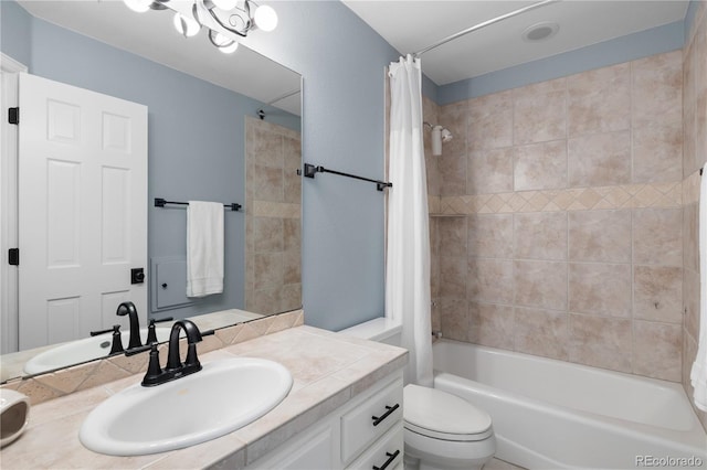 bathroom with shower / bath combo with shower curtain, toilet, and vanity