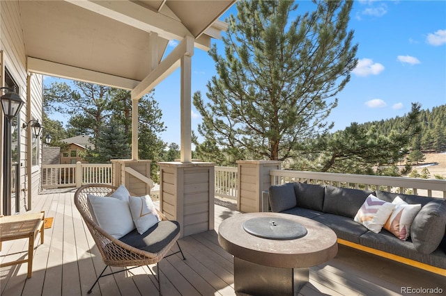 wooden deck with outdoor lounge area