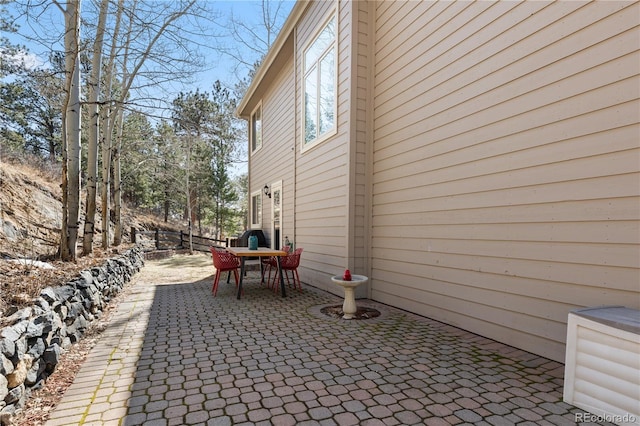 exterior space featuring a patio area and outdoor dining area