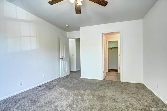 1997 E 102nd Cir, Thornton, CO 80229 - unfurnished bedroom with carpet flooring, a spacious closet, and a ceiling fan