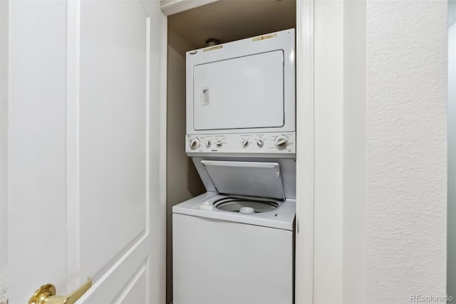 washroom with laundry area and stacked washer and dryer