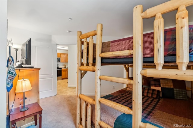 bedroom with light colored carpet