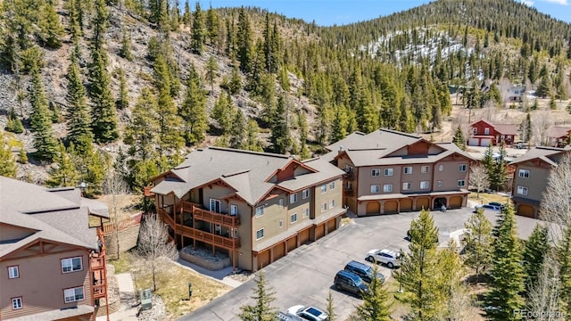 birds eye view of property featuring a mountain view