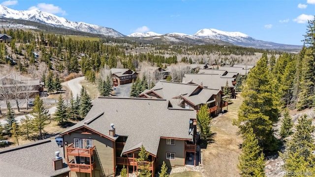 birds eye view of property with a mountain view