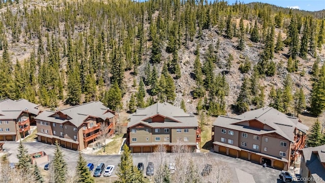 bird's eye view featuring a view of trees and a residential view