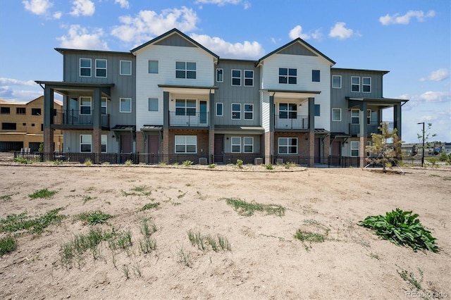 6940 Merseyside Ln, Castle Pines, CO 80108 - back of property featuring board and batten siding and brick siding