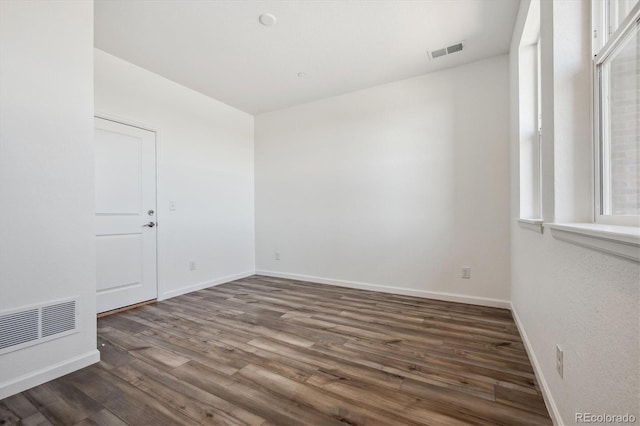 empty room featuring dark hardwood / wood-style floors