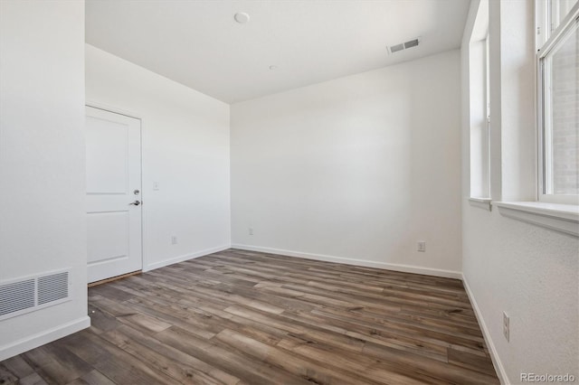 6940 Merseyside Ln, Castle Pines, CO 80108 - unfurnished room featuring wood finished floors and baseboards