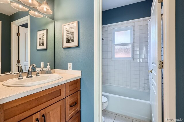821 S High St, Denver, CO 80209 - bathroom with toilet, tile patterned floors, vanity, shower / bath combination with curtain, and a textured wall
