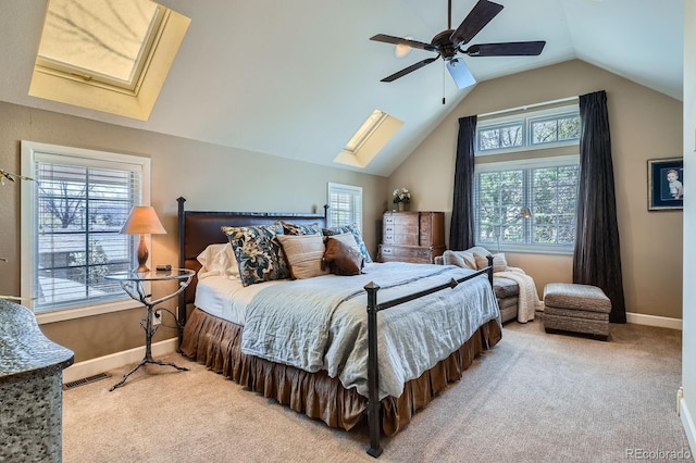 821 S High St, Denver, CO 80209 - carpeted bedroom with a skylight, baseboards, vaulted ceiling, and ceiling fan
