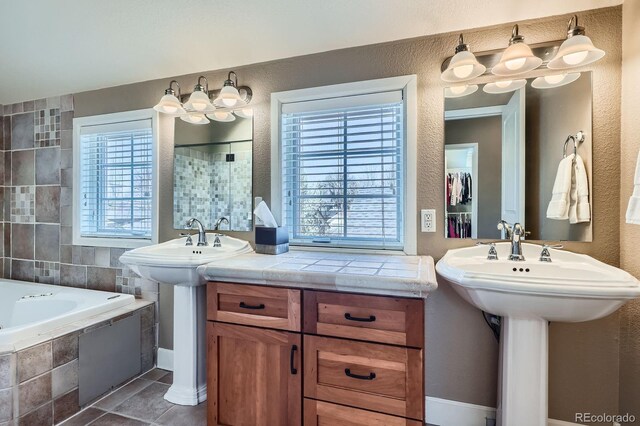 821 S High St, Denver, CO 80209 - full bathroom featuring a textured wall, tiled bath, and a tile shower