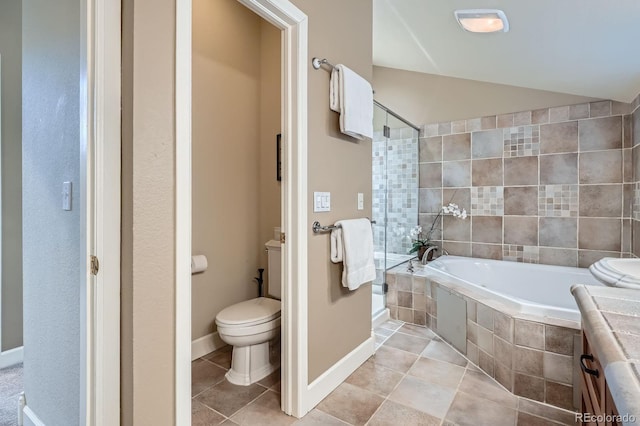 821 S High St, Denver, CO 80209 - bathroom with a garden tub, toilet, tile patterned flooring, lofted ceiling, and baseboards