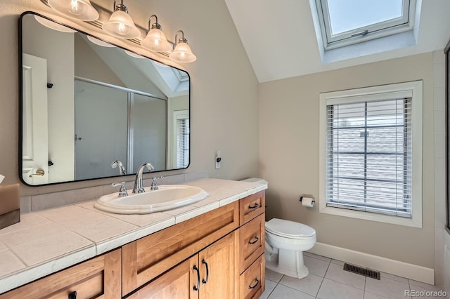 821 S High St, Denver, CO 80209 - bathroom with a skylight, vaulted ceiling, tile patterned flooring, a shower with shower door, and vanity