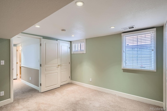 821 S High St, Denver, CO 80209 - below grade area with light colored carpet, baseboards, recessed lighting, and a textured ceiling