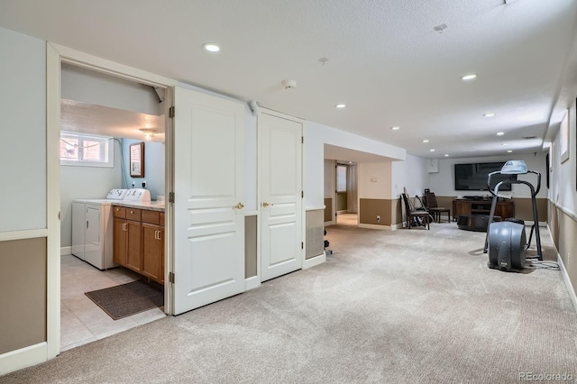 821 S High St, Denver, CO 80209 - basement featuring washer and clothes dryer, light colored carpet, a desk, recessed lighting, and baseboards