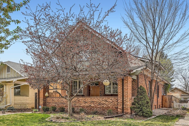 821 S High St, Denver, CO 80209 - view of front of property with brick siding and fence