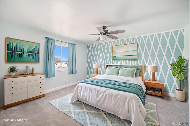 carpeted bedroom with baseboards and a ceiling fan