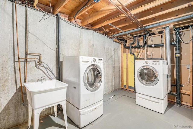 clothes washing area with laundry area and independent washer and dryer