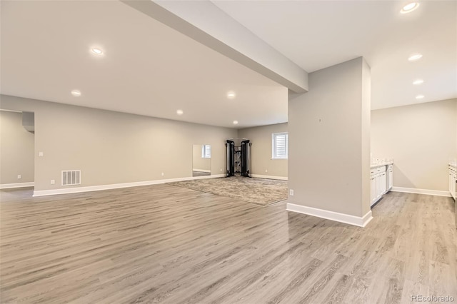 unfurnished living room with light wood-type flooring