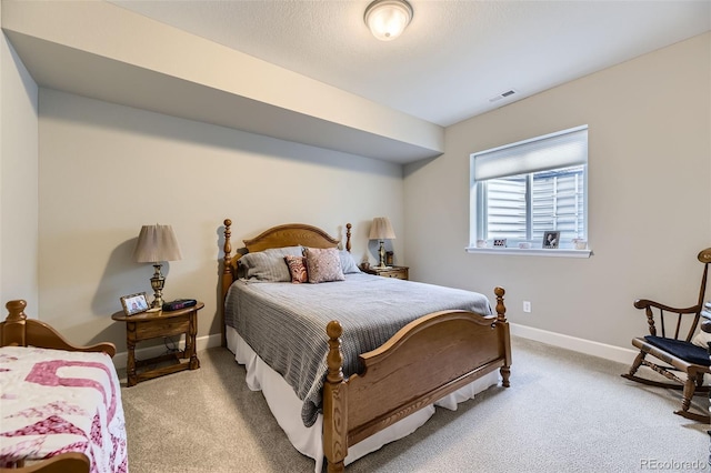 bedroom with light carpet