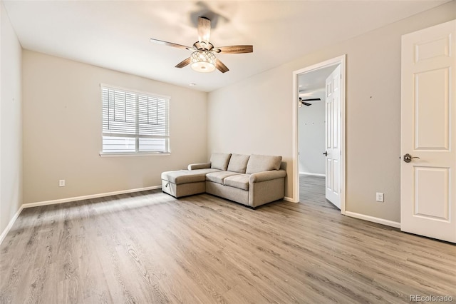 unfurnished living room with ceiling fan and light wood-type flooring