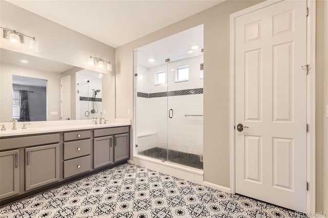 bathroom with tile patterned flooring, vanity, and an enclosed shower