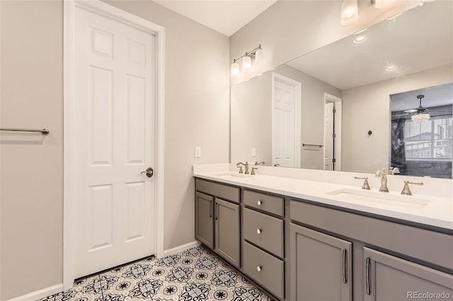 bathroom featuring ceiling fan, tile patterned flooring, and vanity