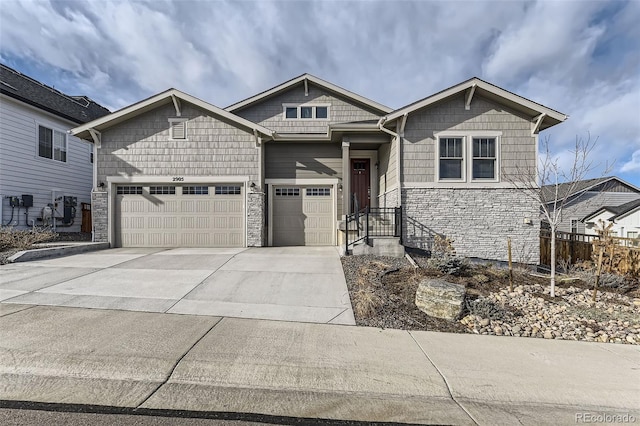 2905 Morningbird Ln, Castle Rock, CO 80109 - view of front of house featuring stone siding, concrete driveway, and an attached garage