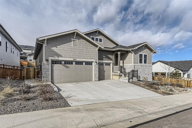 2905 Morningbird Ln, Castle Rock, CO 80109 - view of front facade featuring stone siding, concrete driveway, and a garage