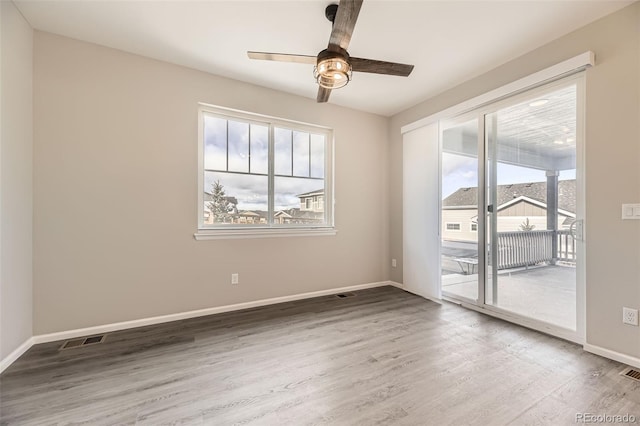 2905 Morningbird Ln, Castle Rock, CO 80109 - spare room featuring healthy amount of natural light, a ceiling fan, and wood finished floors