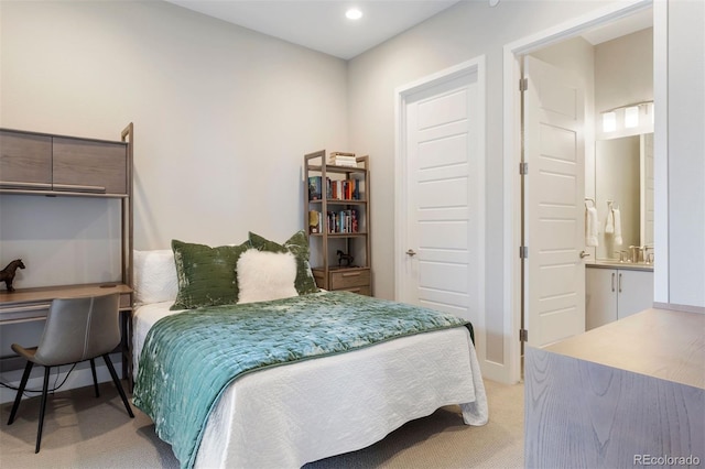 carpeted bedroom with connected bathroom