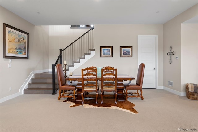 dining space featuring carpet floors