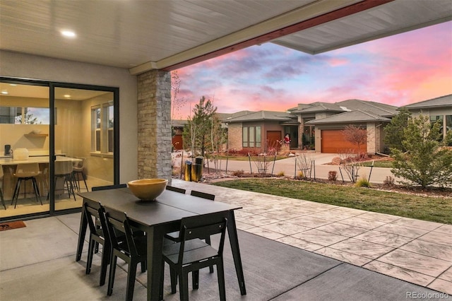 view of patio terrace at dusk