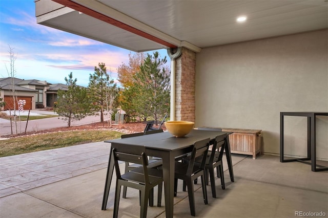 view of patio terrace at dusk