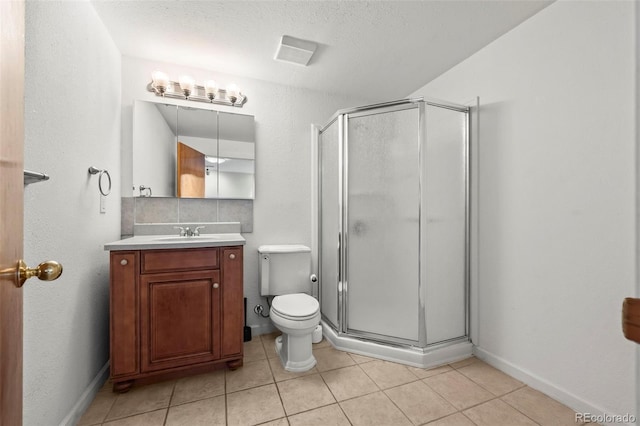 584 Ridgeview Dr, Louisville, CO 80027 - full bath with vanity, a stall shower, tile patterned floors, toilet, and baseboards