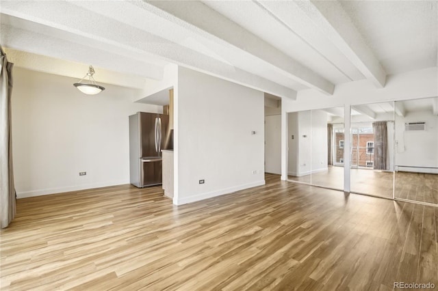 unfurnished living room with light wood-type flooring, a baseboard radiator, baseboards, and beamed ceiling