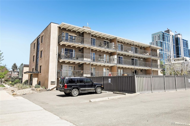 view of property with uncovered parking