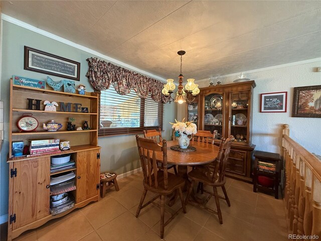 21300 County Road 13, La Jara, CO 81140 - dining area featuring an inviting chandelier, ornamental molding, and light tile patterned flooring