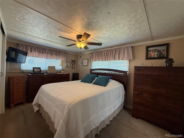 21300 County Road 13, La Jara, CO 81140 - bedroom featuring light colored carpet, ceiling fan, and a textured ceiling